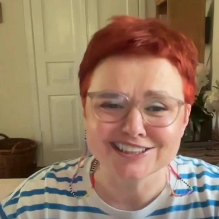 Oksana T., TEEI Language participant, smiling during a video conversation